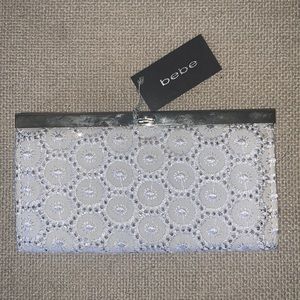 Bebe eyelet sparkle clutch